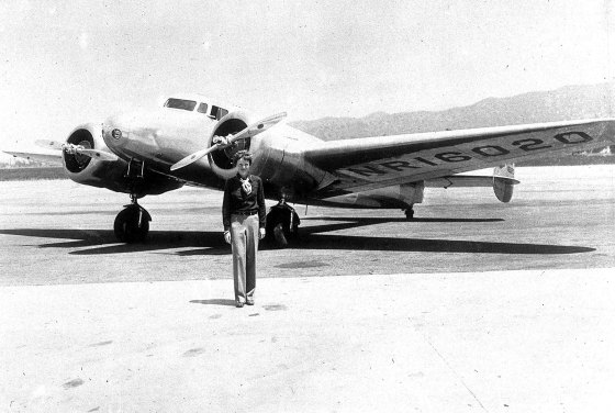 18th March 1937, American aviator Miss Amelia Earhart is pictured with her ,Flying Laboratory in which she is attempting to fly around the world from her oakland, California, USA base